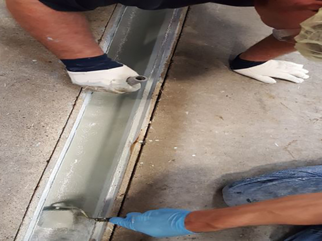 repairing gutter joint in concrete floor